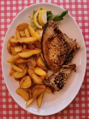 Fried Tuna Steaks on  White Plate  on Table