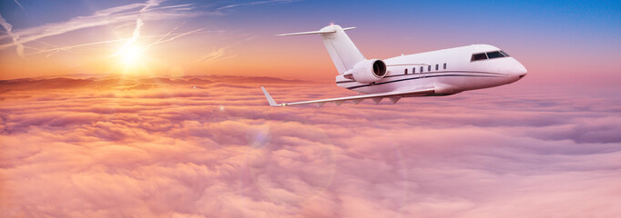 Fototapeta na wymiar Small private jetplane flying above beautiful clouds. Travel and transportation concept.