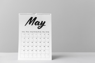 Flip calendar on table against light background