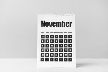 Flip calendar on table against light background
