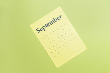 Sheet of paper calendar on color background