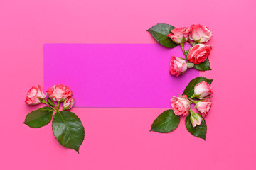Empty greeting card with beautiful flowers on color background