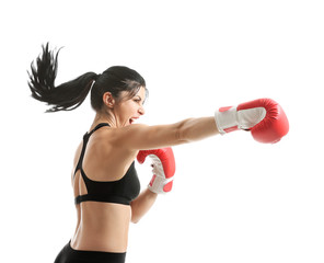 Sporty female boxer on white background
