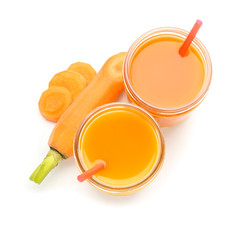 Glasses of fresh carrot juice on white background