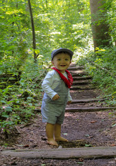 adorable little boy in the park train tracks