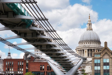 Fototapeta premium St Paul's Cathedral and Millennium Footbridge over the Thames river, London, United Kingdom .