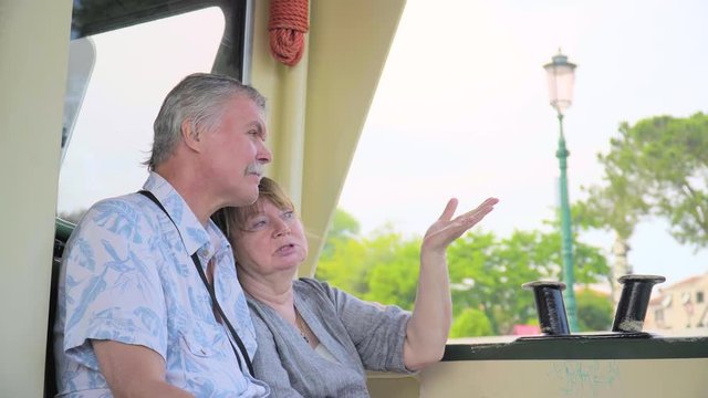 Senior Couple Relaxing On Boat Journey