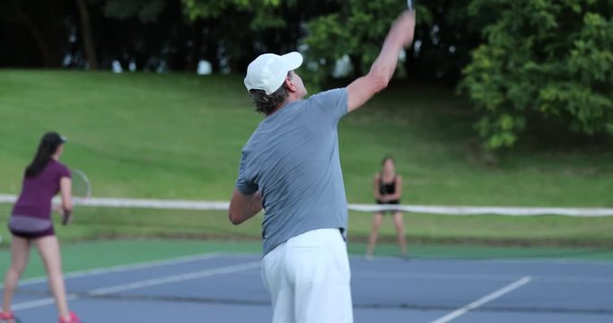 Senior man serving tennis game failing