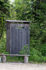 Fototapeta premium Traditional outhouse in woods
