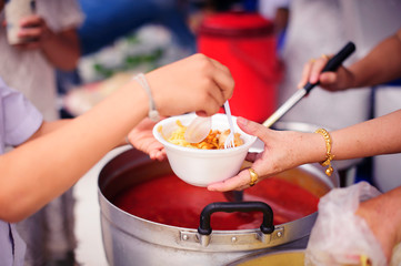 Concept of famine and social inequality : Free food for the poor and Food distribution : Sharing Food With Homeless : concept Tackling Hunger and Food
