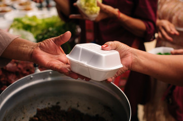 Concept of famine and social inequality : feeding food for beggar poverty concept : The society of helping to share food to the poor : Serving the Homeless Hungry and Poor
