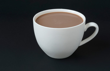 cup of chocolate with milk on black background