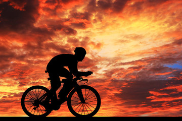 Silhouette  Cycling  on blurry sunrise  sky   background.