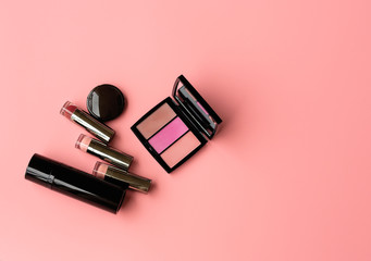  Set of Professional Cosmetic: Lipstics,make up shade or Illuminate Cheeks on a Pink Background. Top View. Copy Space for text