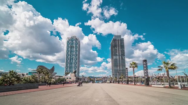 Barcelona olympic port, ciutadella vila olimpica, in a summer day (timelapse, time lapse, time-lapse). Twin towers - Hotel Arts and Torre Mapfre - and the Marina street