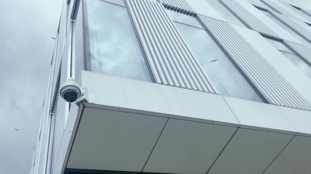 Monitoring outside the building, in the background there is a blue sky with moving clouds, a safe place to work and learn