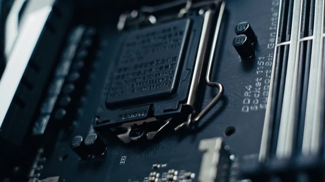 Pan across black shiny motherboard