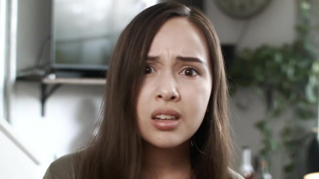 Angry Young Woman Looking Into Camera Making Different Faces