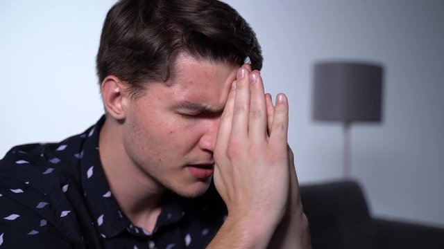 Millennial Caucasian Man Experiencing Loss is Desperate and Sad Breathing Hard