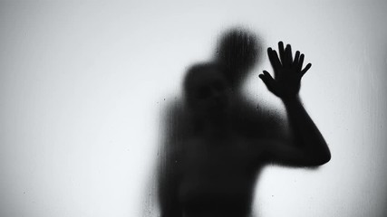 Silhouette of lovers couple hugging and kissing in shower, intimate relationship