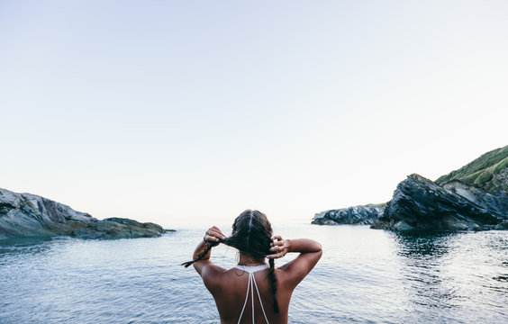 A woman on a beach in Cornwall