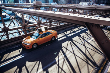 Cab crossing the Brooklyn Bridge.