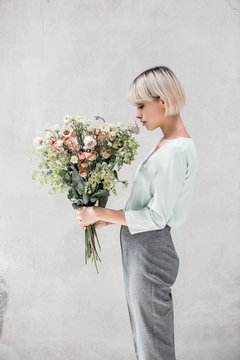 woman holding a boquet