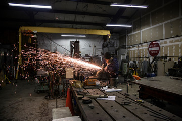 Working in a blacksmith shop.