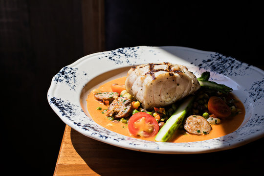 Healthy fish, sausage, and vegetable meal
