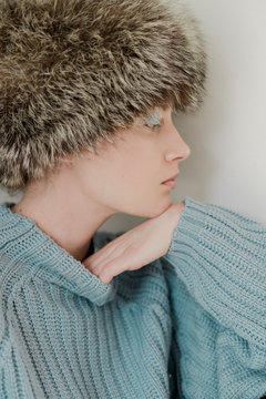 Portrait of a female model in blue sweater
