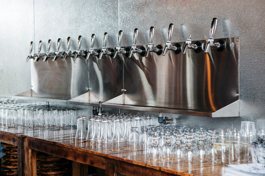 A line of taps at a bar
