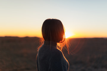 woman goes calm at sunset