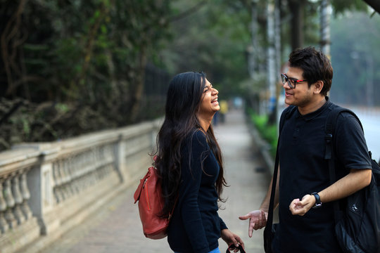 College students enjoying interaction and making fun at outdoors