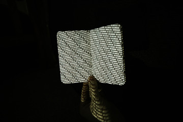 Binary Code projected onto physical notepad.