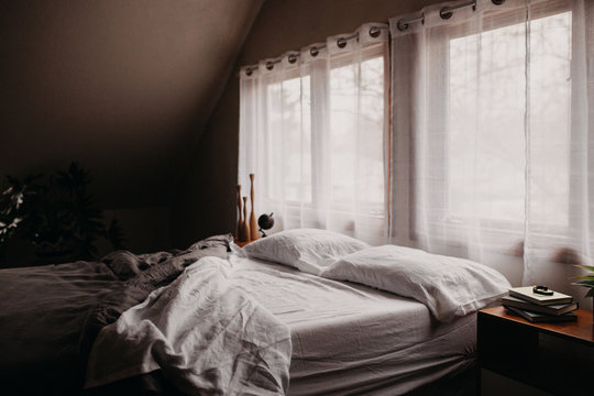 Cozy Bedroom Scene with Unmade Bed
