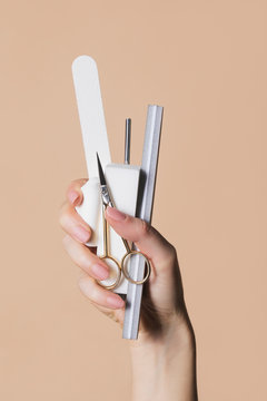 Woman Holding Manicure Kit