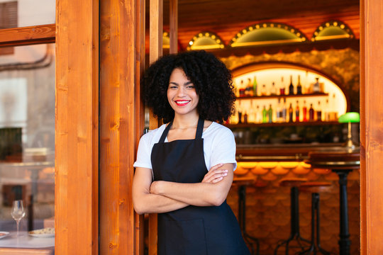 Portrait of a smiling waitress.
