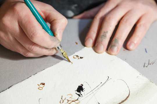 A calligrapher creating artworks in his workshop