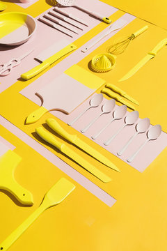 Pink and yellow kitchen objects/utensil.