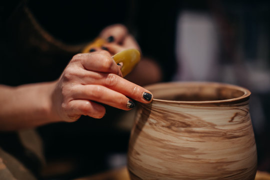 Potter Making Pots in Studio