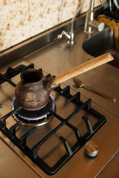 Old coffee turk is heating on stove