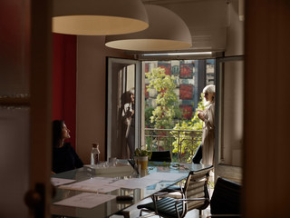 Women in stylish office relaxing and chatting