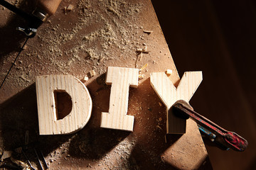 DIY written on a workshop table
