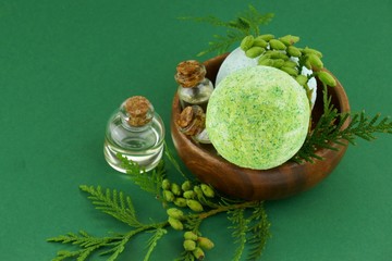 bath bombs and thuja essential oil. Organic  essential oil in glass bottles set and a green bomb...