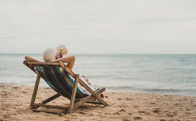 Asia woman relax on beach chair at Pattaya, Thailand