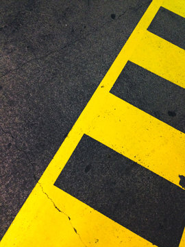 Yellow parking lines painted on the asphalt