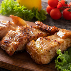 Grilled sturgeaon. Tasty fish on a wooden board. Closeup