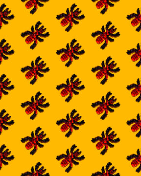 Bug-shaped candy on yellow background