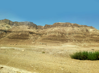 Desert landscape with rocks, hills and mountains