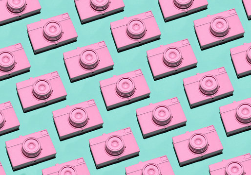 Pink film cameras pattern on cyan background